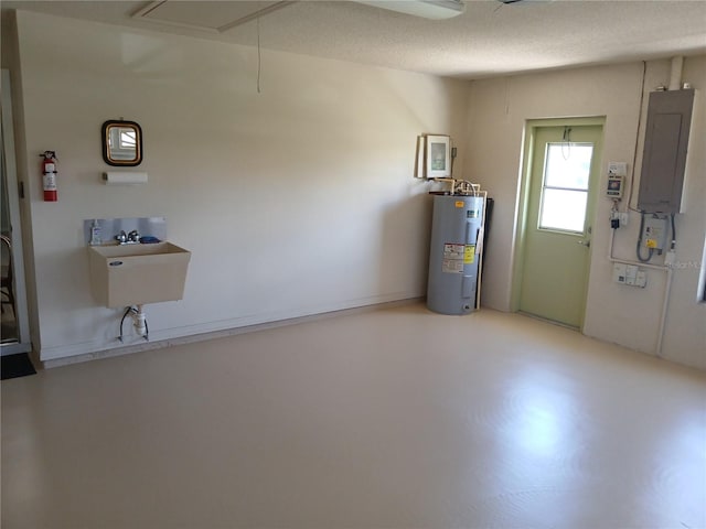 garage with sink, electric panel, and water heater