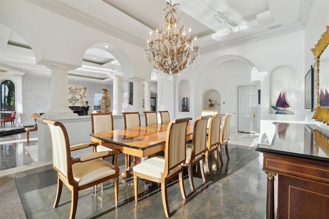 dining area featuring ornamental molding, a tray ceiling, and decorative columns