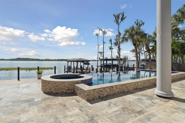 view of pool featuring a dock and a water view