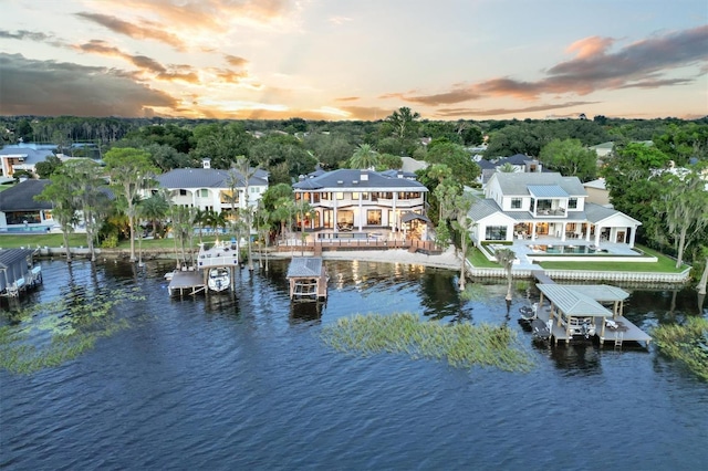 aerial view at dusk with a water view