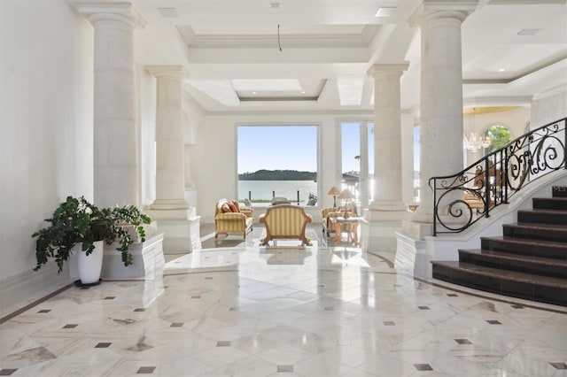 building lobby featuring stairs and a water view