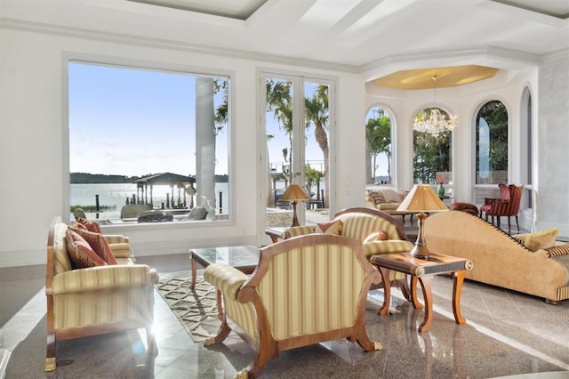 sunroom / solarium with a notable chandelier