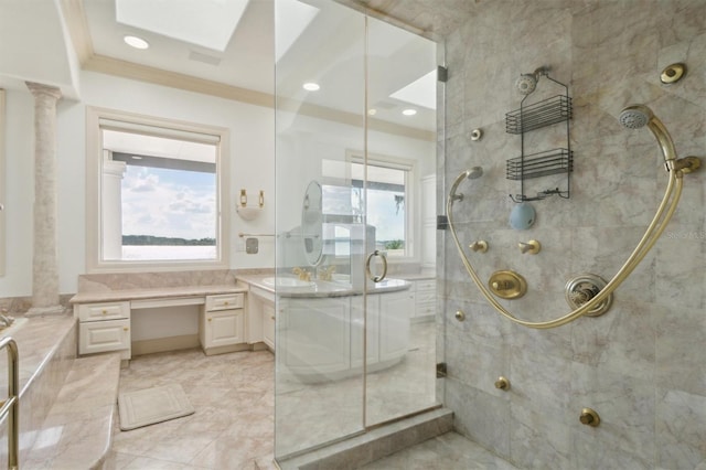 full bath with crown molding, a skylight, vanity, a shower stall, and ornate columns