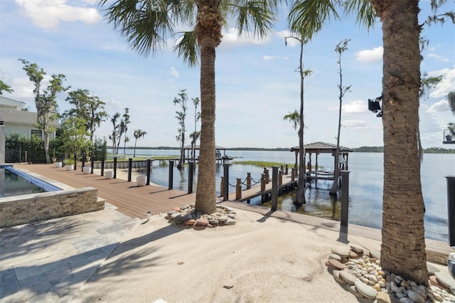 view of dock featuring a water view and boat lift