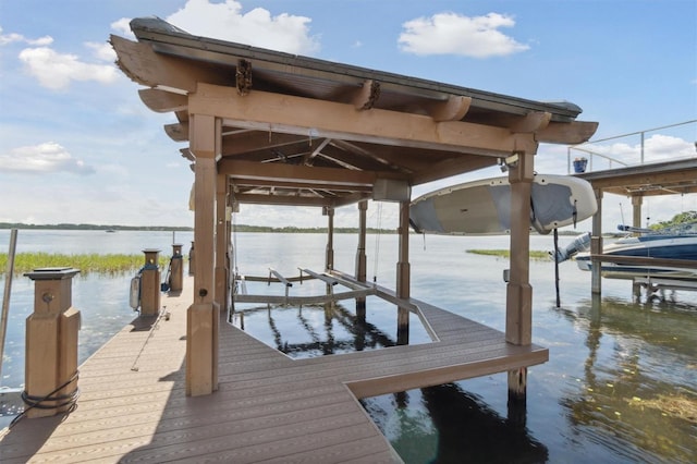 view of dock featuring a water view and boat lift