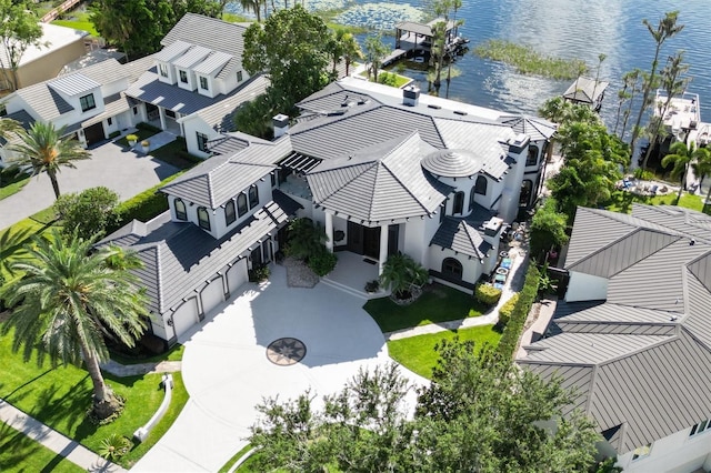 birds eye view of property with a water view