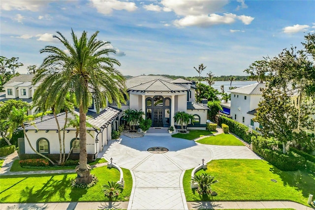 view of front of house featuring french doors and a front lawn