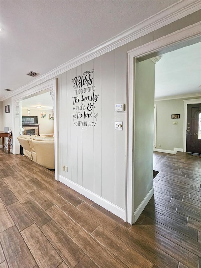 corridor featuring ornamental molding