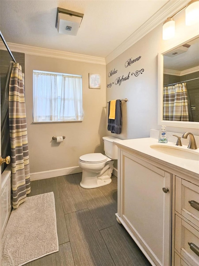 full bathroom with toilet, vanity, shower / tub combo, and ornamental molding