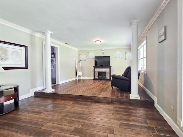 living area featuring crown molding and a fireplace