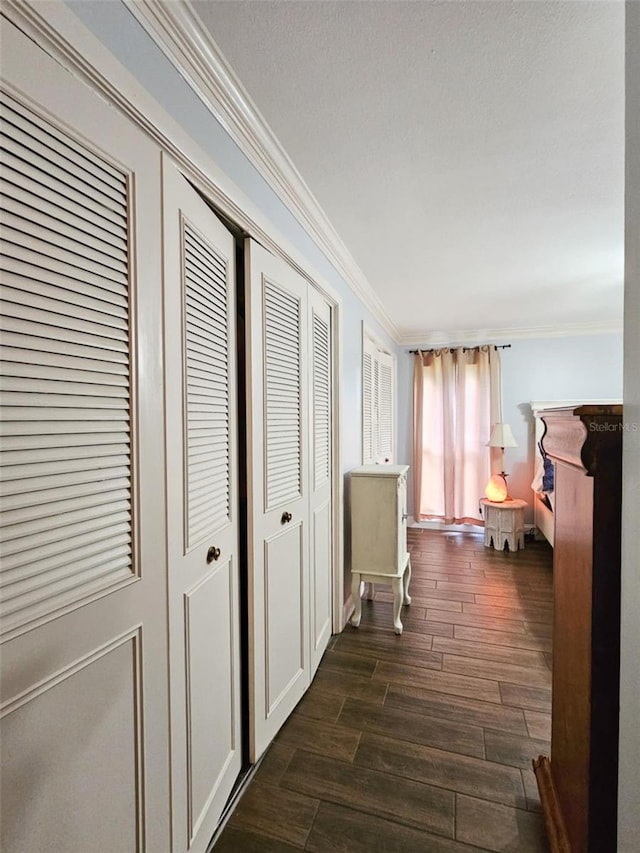 hallway featuring crown molding and dark hardwood / wood-style floors