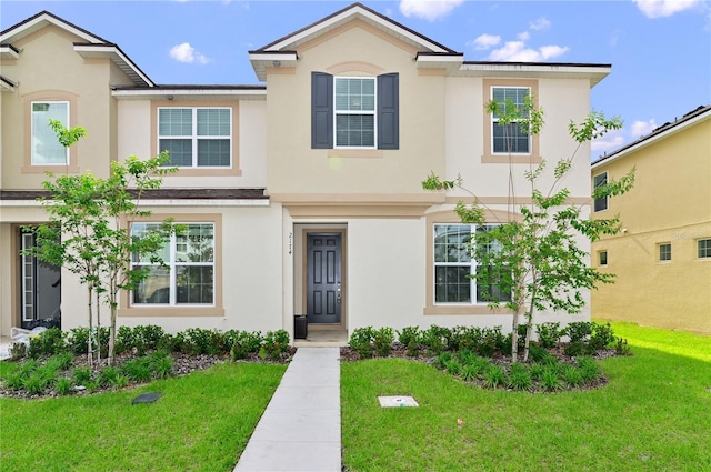 view of front of home featuring a front lawn