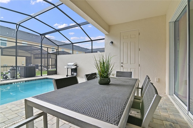 view of swimming pool featuring a patio, glass enclosure, central air condition unit, and a grill