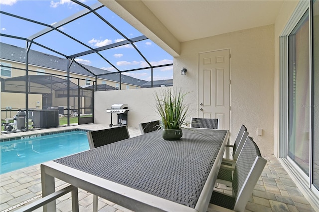 view of pool with a patio, grilling area, and a lanai