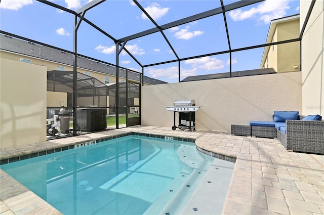 view of swimming pool with a patio area, an outdoor hangout area, and glass enclosure