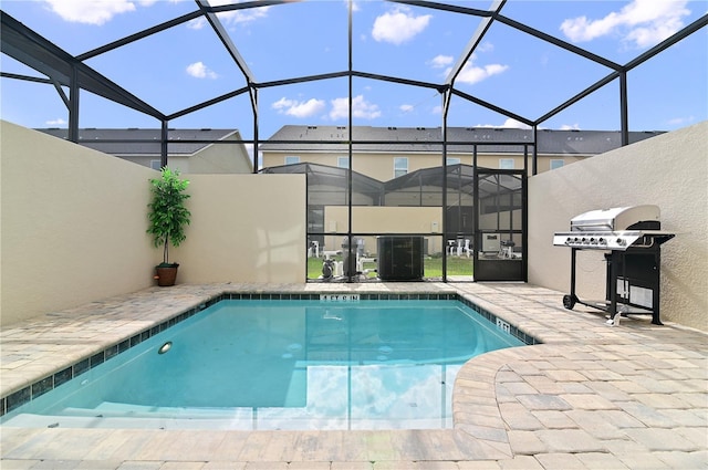 view of pool featuring a patio, central AC unit, area for grilling, and a lanai