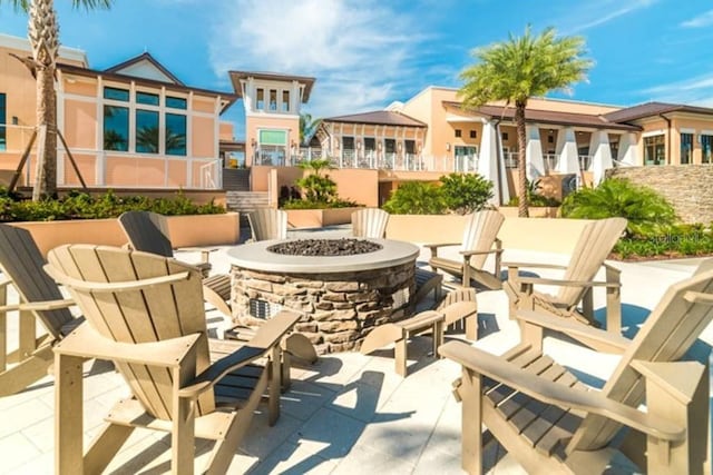 view of patio / terrace featuring an outdoor fire pit