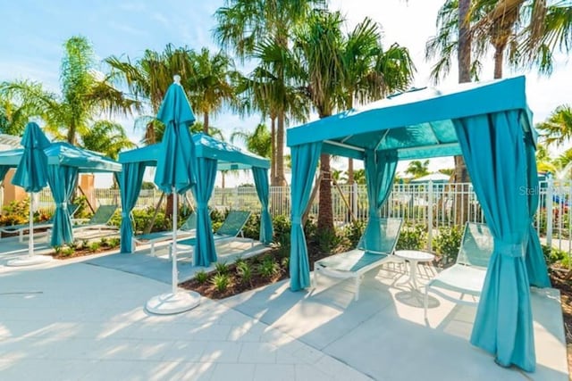 view of play area with a gazebo and a patio area