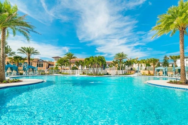 view of pool with pool water feature