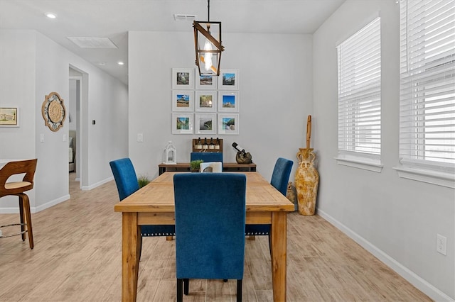 dining space featuring light wood-type flooring