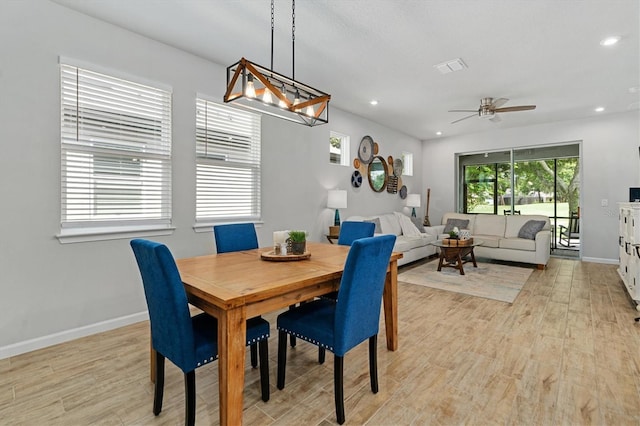 dining room featuring ceiling fan and light hardwood / wood-style floors