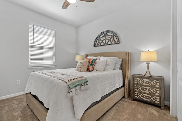 bedroom featuring ceiling fan and carpet