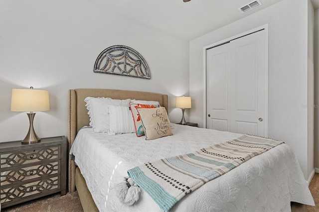 carpeted bedroom featuring a closet