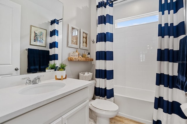 full bathroom with tile patterned floors, toilet, vanity, and shower / tub combo with curtain