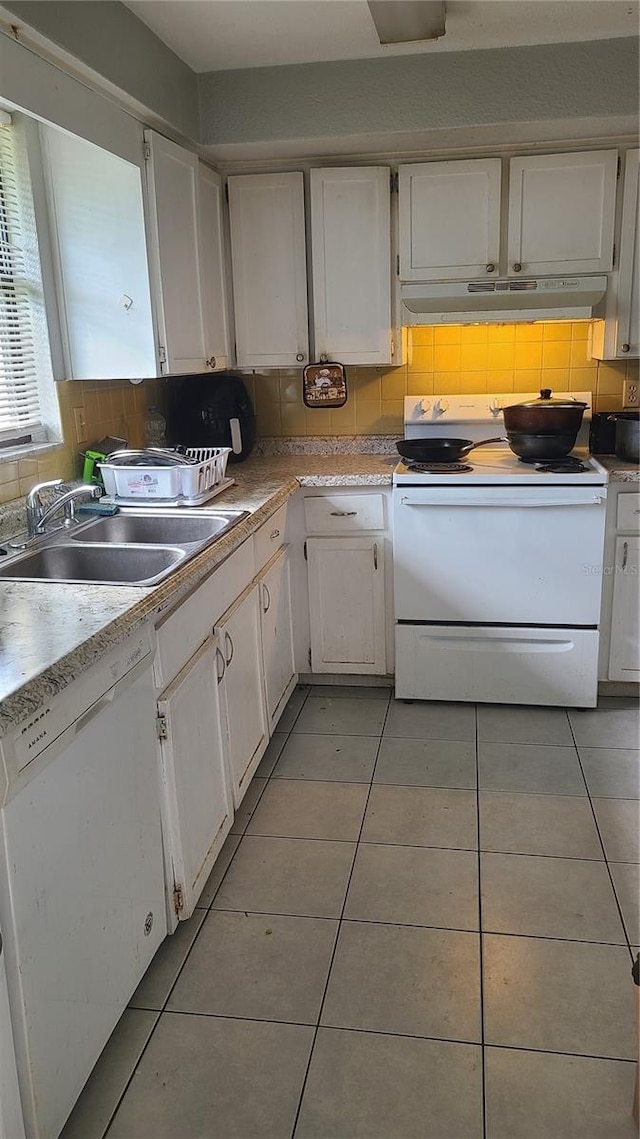 kitchen featuring white cabinetry, sink, white appliances, and decorative backsplash