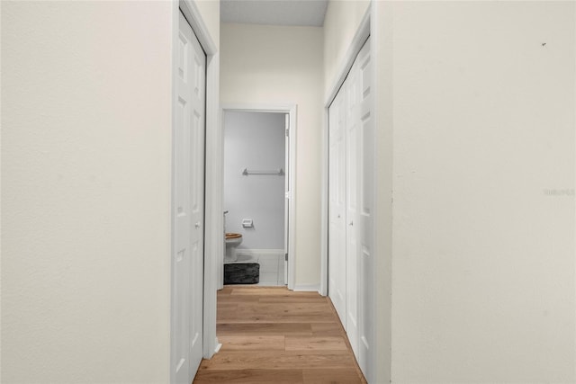 corridor featuring light hardwood / wood-style floors