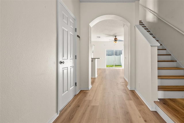 corridor with light wood-type flooring