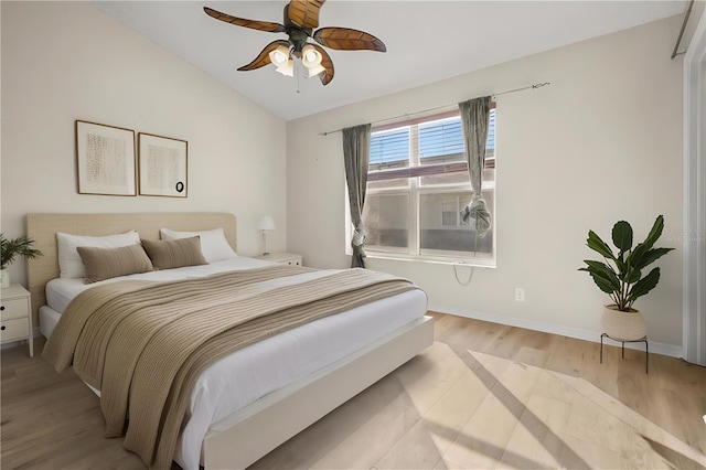 bedroom featuring lofted ceiling, ceiling fan, and light hardwood / wood-style floors