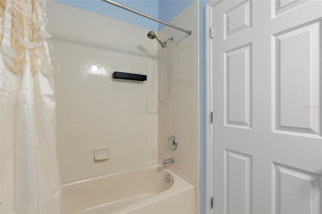 bathroom with shower / tub combo