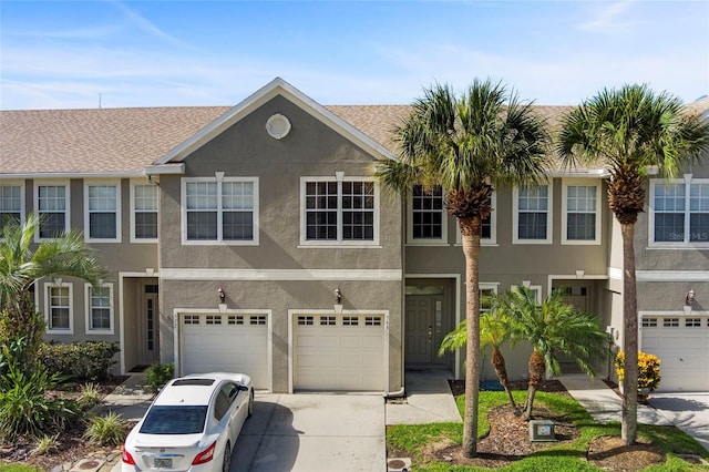 townhome / multi-family property featuring a garage