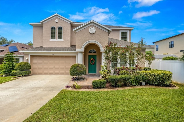 view of front of home featuring a garage and a front yard