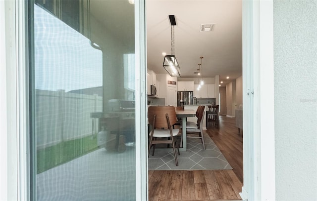 dining area featuring wood-type flooring