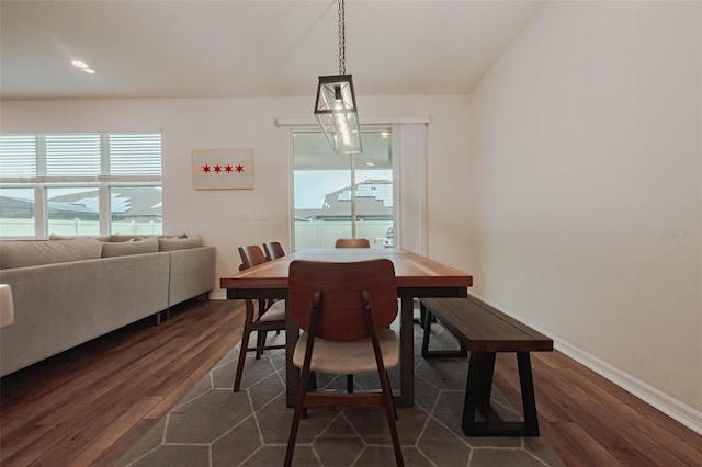 dining area with dark wood-type flooring