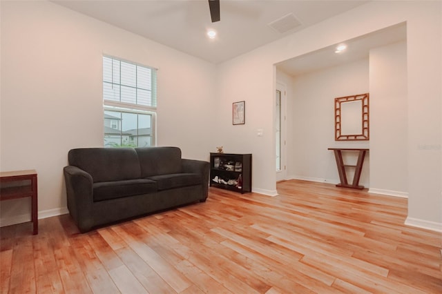 sitting room featuring ceiling fan and light wood-type flooring