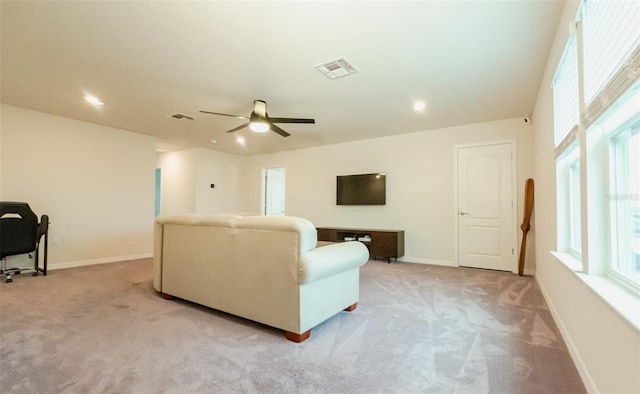 living room with ceiling fan and light carpet