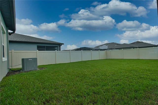 view of yard with central AC unit