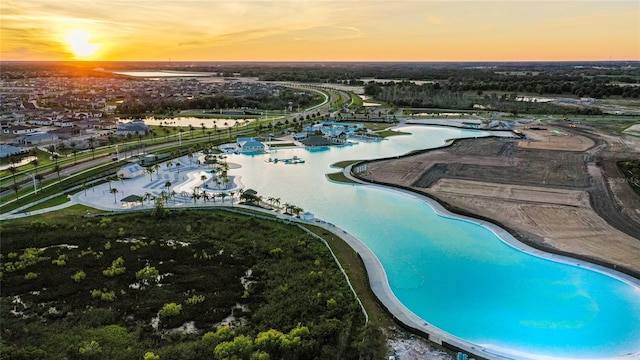 aerial view at dusk with a water view