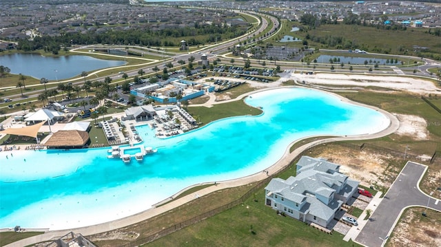 birds eye view of property with a water view