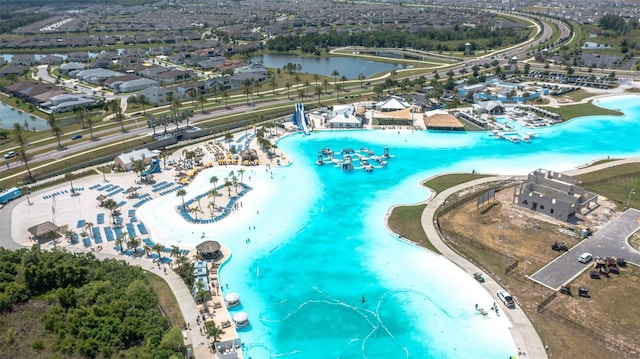 drone / aerial view with a water view and a view of the beach