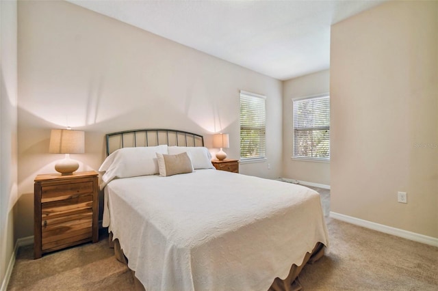 bedroom featuring light carpet