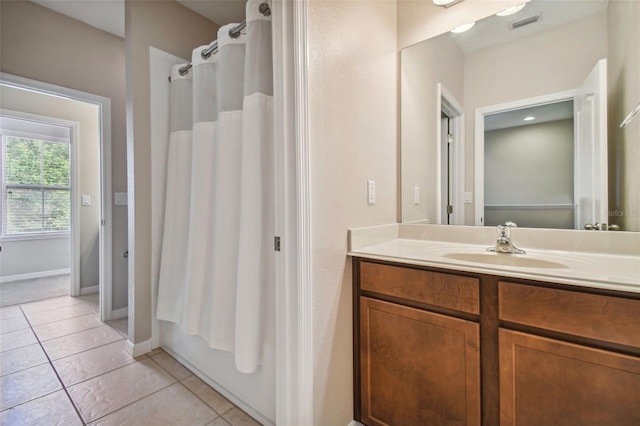 bathroom featuring vanity, tile patterned flooring, and shower / bathtub combination with curtain