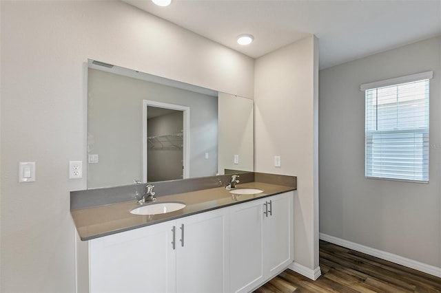 bathroom featuring vanity and hardwood / wood-style floors