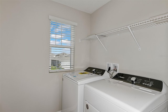 washroom with washing machine and dryer