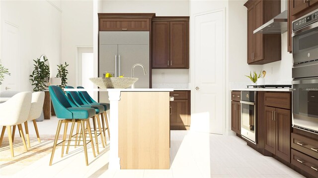 kitchen with stainless steel oven, paneled built in fridge, and wall chimney exhaust hood