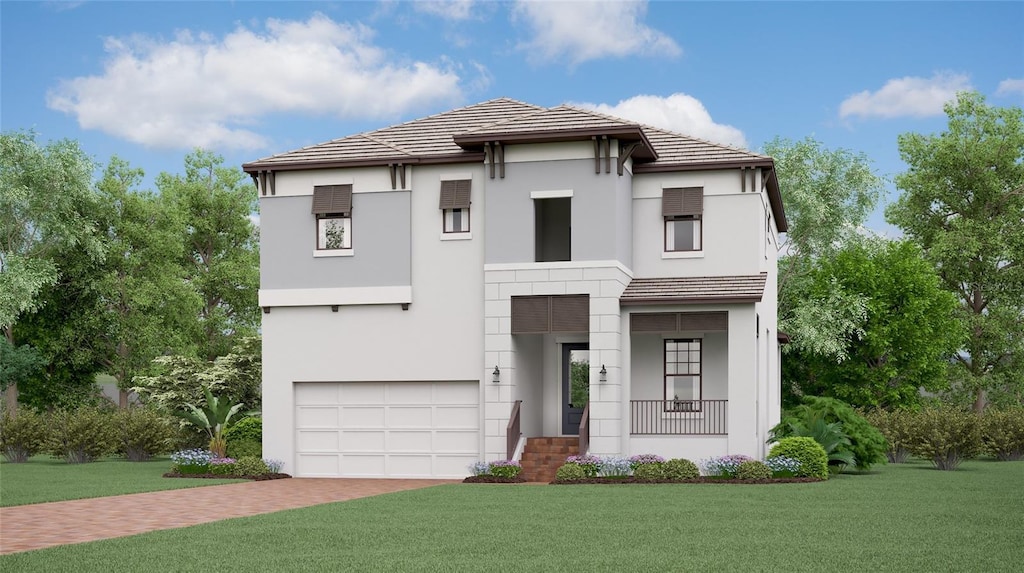 view of front of house featuring a garage and a front lawn