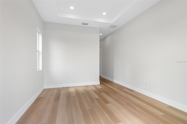 empty room with light hardwood / wood-style floors